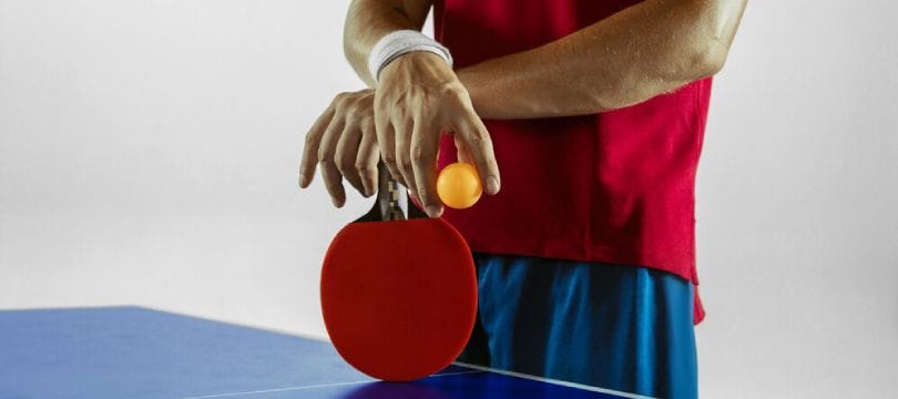 man playing table tennis